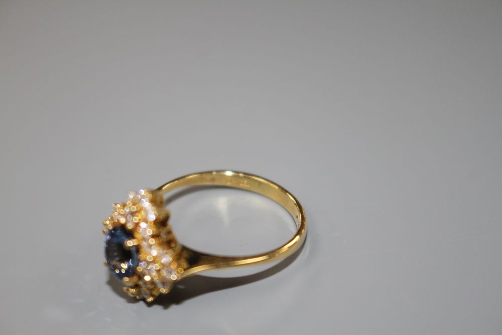 A modern 18ct gold, sapphire and diamonds set quatrefoil shaped cluster ring, size M, gross 4 grams